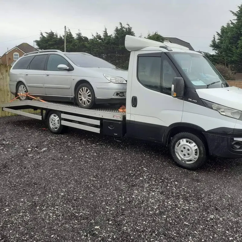 Estate car on a recovery truck near Staveley